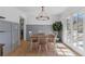 Dining room with wainscoting, modern light fixture and glass doors at 4304 Lake Laurel Se Dr, Smyrna, GA 30082