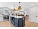 Stylish, open-concept kitchen with an island, modern appliances, and seamless access to the cozy living room at 4304 Lake Laurel Se Dr, Smyrna, GA 30082