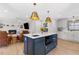 Open-concept kitchen featuring a large island, pendant lighting, and modern appliances at 4304 Lake Laurel Se Dr, Smyrna, GA 30082