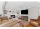 Inviting living room featuring a fireplace, hardwood floors, and comfortable seating at 4304 Lake Laurel Se Dr, Smyrna, GA 30082