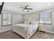 Comfortable main bedroom with neutral colors, natural light, and a ceiling fan at 4304 Lake Laurel Se Dr, Smyrna, GA 30082
