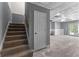 Stairs leading down to a basement with white walls and a walkout to the backyard at 821 Hood Rd, Fayetteville, GA 30214