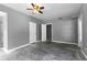 Spacious bedroom features a ceiling fan and neutral paint, ready for customization at 821 Hood Rd, Fayetteville, GA 30214