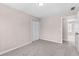 Bedroom featuring carpet, neutral paint, double door closet and an open doorway at 821 Hood Rd, Fayetteville, GA 30214