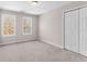 Bedroom with carpet, double door closet and windows for natural light at 821 Hood Rd, Fayetteville, GA 30214