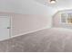 Spacious bonus room featuring neutral paint, gray carpet, and a window for natural light at 821 Hood Rd, Fayetteville, GA 30214