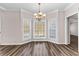 Bay window dining nook with hardwood floors and elegant chandelier at 821 Hood Rd, Fayetteville, GA 30214