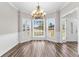 Elegant dining room featuring wood flooring, crown molding, and bay window at 821 Hood Rd, Fayetteville, GA 30214