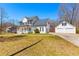 Charming two-story home with a welcoming front porch and a detached two-car garage at 821 Hood Rd, Fayetteville, GA 30214