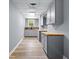 Hallway with updated cabinets and modern finishes, leading to additional living spaces at 821 Hood Rd, Fayetteville, GA 30214