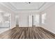 The primary bedroom features hardwood floors, neutral walls, an ensuite bathroom, and walk-in closet at 821 Hood Rd, Fayetteville, GA 30214