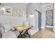 Eat-in breakfast nook with a built-in bench, white shiplap walls, and decorative wall plates at 212 Sessions St, Woodstock, GA 30188