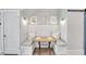 Eat-in breakfast nook with a built-in bench, white shiplap walls, and decorative wall plates at 212 Sessions St, Woodstock, GA 30188
