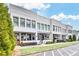 Stylish two-story townhome featuring covered patios and lush landscaping in a well maintained community at 212 Sessions St, Woodstock, GA 30188