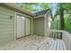 View of an exterior deck overlooking the yard, accessed by a sliding glass door at 5248 Martins Crossing Rd, Stone Mountain, GA 30088