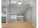 View of the living room showcasing a vaulted ceiling, and stairs leading to the lower level at 5248 Martins Crossing Rd, Stone Mountain, GA 30088