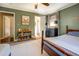 Bedroom featuring two doors, a bookshelf, and an olive-green painted wall with two beds at 5327 David Cir, Covington, GA 30014