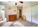 Cozy Bedroom featuring a changing table, ample storage, and soft pastel décor at 5327 David Cir, Covington, GA 30014