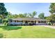 Charming ranch-style home with a well-manicured lawn, featuring a classic brick facade and mature landscaping at 5327 David Cir, Covington, GA 30014
