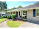 Charming covered front porch with seating and landscaped surroundings at 5327 David Cir, Covington, GA 30014