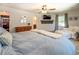 Comfortable bedroom with a large bed, cozy seating area, and ample natural light at 5327 David Cir, Covington, GA 30014