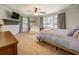 Bright main bedroom with large bed, seating area, and natural light at 5327 David Cir, Covington, GA 30014