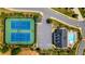 Aerial view of community tennis courts and swimming pool at 5850 Overlook Rdg, Suwanee, GA 30024
