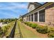 View of the home's backyard featuring well-maintained landscaping, fence, and screened in back porch at 5850 Overlook Rdg, Suwanee, GA 30024