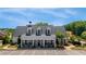 Clubhouse with gray roof, covered porch, and ample parking at 5850 Overlook Rdg, Suwanee, GA 30024