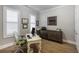 Bright office space featuring two windows, neutral walls, hardwood floors, and crown moulding at 5850 Overlook Rdg, Suwanee, GA 30024