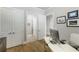 Neutral office space featuring light walls, hardwood floors, and crown moulding at 5850 Overlook Rdg, Suwanee, GA 30024
