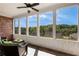 A serene screened porch with views of the lush green surroundings and plenty of natural light at 5850 Overlook Rdg, Suwanee, GA 30024