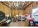 Unfinished attic space with exposed rafters, filled with stored items and potential for customization at 5850 Overlook Rdg, Suwanee, GA 30024