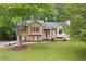 Charming two-story home with a well-maintained lawn, a tree swing, and red window shutters at 685 Maplelake Dr, Acworth, GA 30101