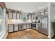 Bright kitchen featuring stainless steel appliances, ample cabinet space, and hardwood floors at 685 Maplelake Dr, Acworth, GA 30101