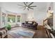 Bright living room with large windows, hardwood floors, and a comfortable sofa at 685 Maplelake Dr, Acworth, GA 30101