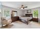 Serene bedroom with neutral tones, a ceiling fan, and plenty of natural light from windows at 685 Maplelake Dr, Acworth, GA 30101