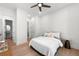 Bright bedroom features hardwood floors, ceiling fan, ensuite bathroom and a walk-in closet at 17145 River Overlook Dr, Roswell, GA 30075