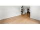 Bright, airy living room features hardwood floors and white walls, leading to the staircase at 17145 River Overlook Dr, Roswell, GA 30075