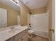 Traditional bathroom features a sink vanity and shower-tub combo at 1745 Collines Sw Ave, Atlanta, GA 30331