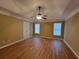 Large bedroom featuring hardwood floors, tray ceiling, and great natural light at 1745 Collines Sw Ave, Atlanta, GA 30331