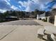 Covered pool area features a large patio area with a stone table and built-in benches at 1745 Collines Sw Ave, Atlanta, GA 30331