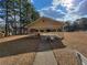 A covered gazebo features a bench, trash can, and a path leading to the tennis courts at 1745 Collines Sw Ave, Atlanta, GA 30331