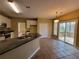 Well-appointed kitchen featuring granite countertops, stainless appliances, and a convenient breakfast bar at 1745 Collines Sw Ave, Atlanta, GA 30331