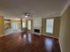 Bright living room featuring hardwood floors, fireplace, and large windows at 1745 Collines Sw Ave, Atlanta, GA 30331
