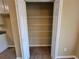 Spacious walk-in pantry with white wire shelving for optimal storage and organization at 1745 Collines Sw Ave, Atlanta, GA 30331