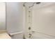 Clean, all-white bathroom features a shower-tub combo and functional fixtures at 1807 Queen Anne Ct, Sandy Springs, GA 30350