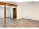 Spacious living room featuring wood beam accents and durable vinyl floors at 1807 Queen Anne Ct, Sandy Springs, GA 30350