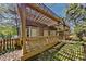 Inviting covered porch with wood floors and attractive pergola at 2068 Signal Ridge Nw, Kennesaw, GA 30152