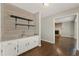 Stylish bar area with granite counters and wooden shelves at 2068 Signal Ridge Nw, Kennesaw, GA 30152